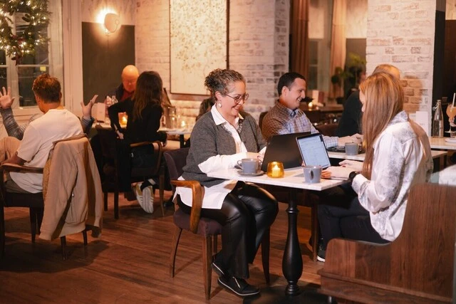 House21 co-working lounge with warm lighting and members at work